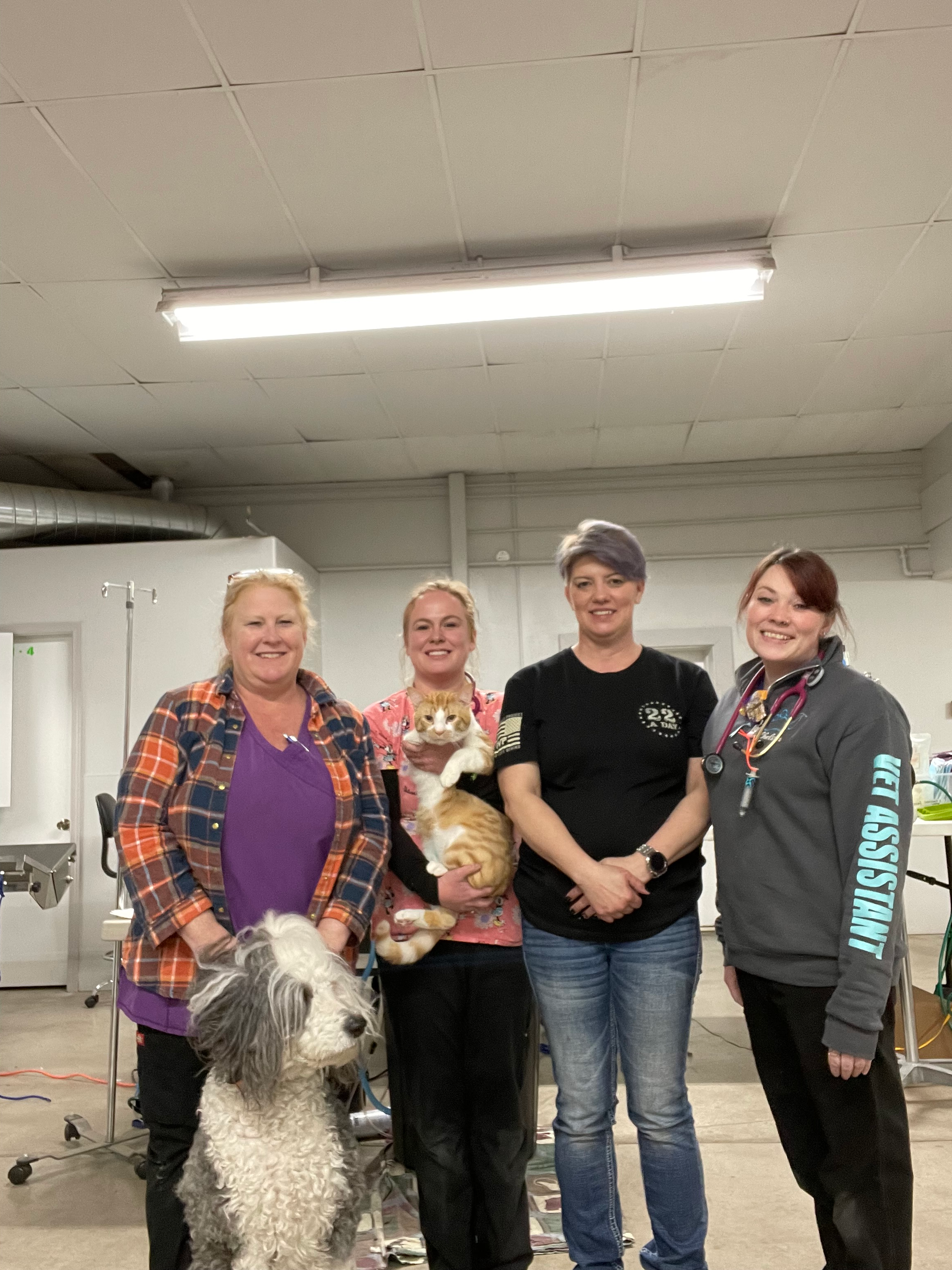 Clinic staff welcoming local pet owners for community wellness support